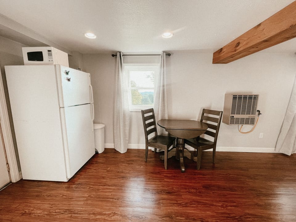 Fridge, microwave and table