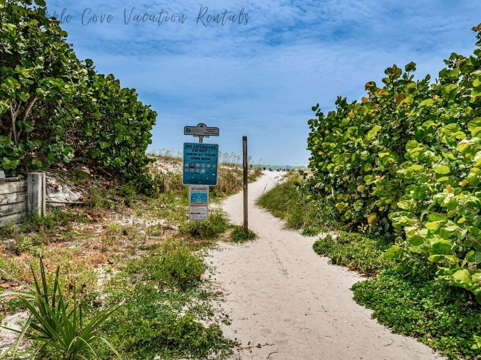 Beach access is located downstairs next to the building