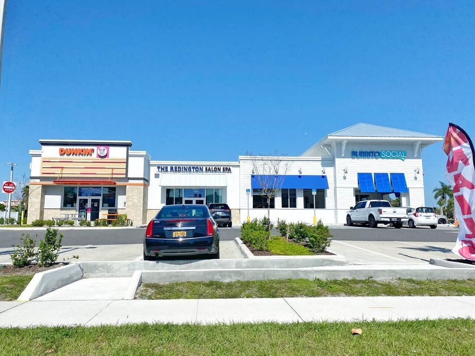 Dunkin' Donuts, Salon/Spa, & Burrito Social located across the street