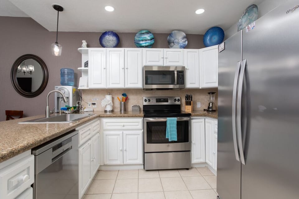 Kitchen is fully stocked with essential cookware for culinary delights!