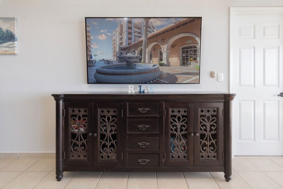 70" Smart TV with DirectV cable and streaming services.