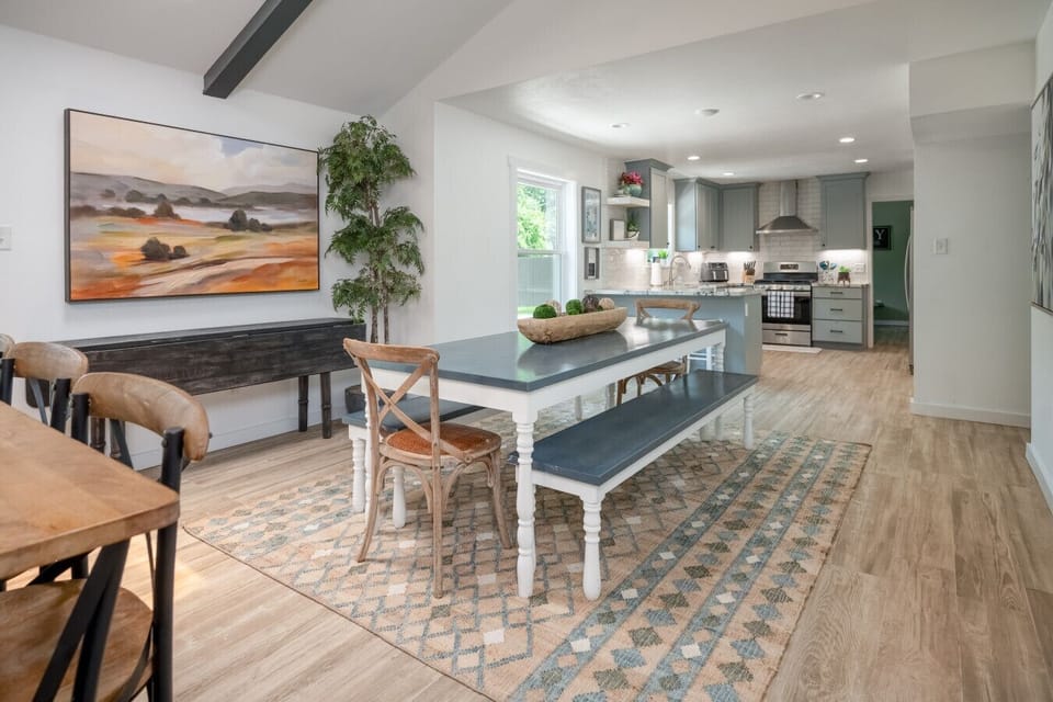 Bright dining space opens seamlessly into the fully stocked kitchen — ideal for family meals or entertaining