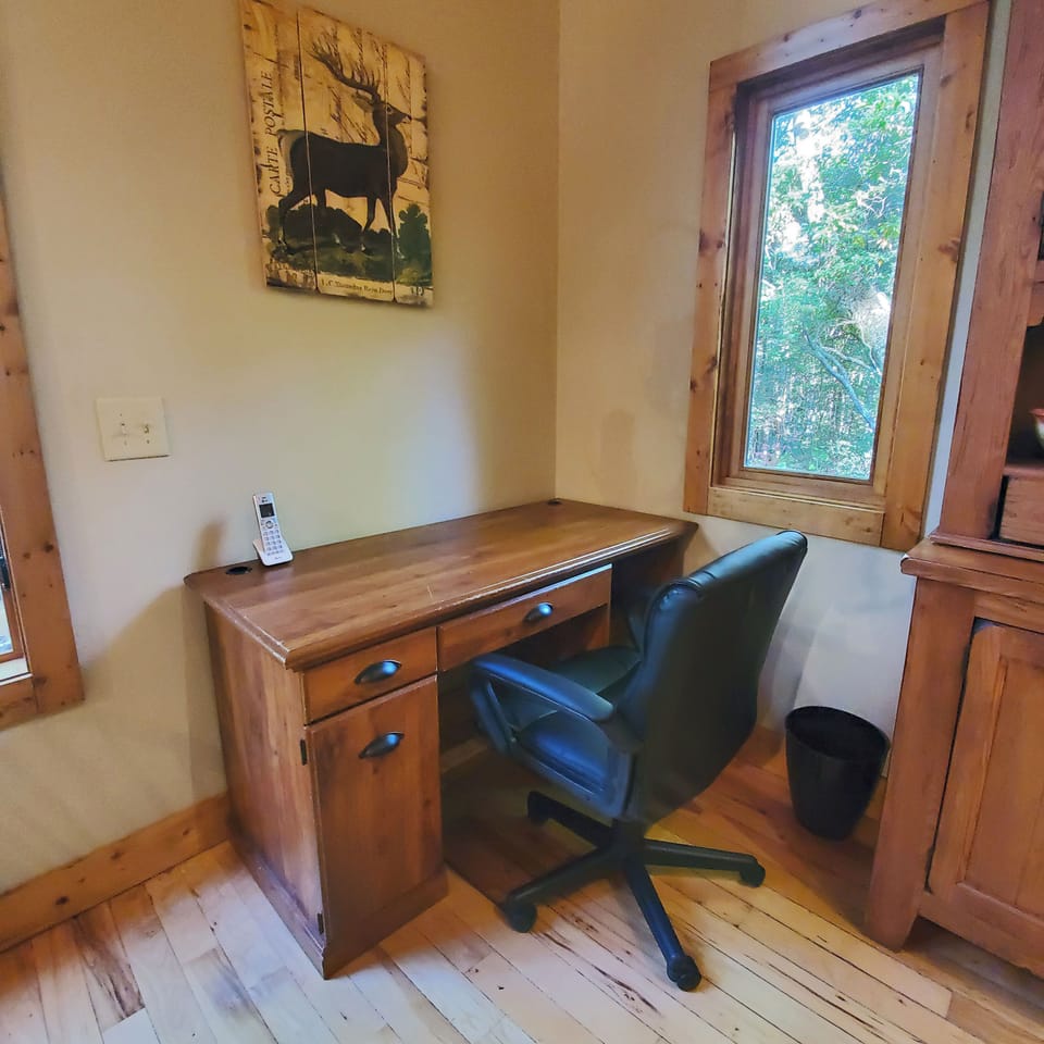 Nice spot to get some work done. Desk w/rolling office chair