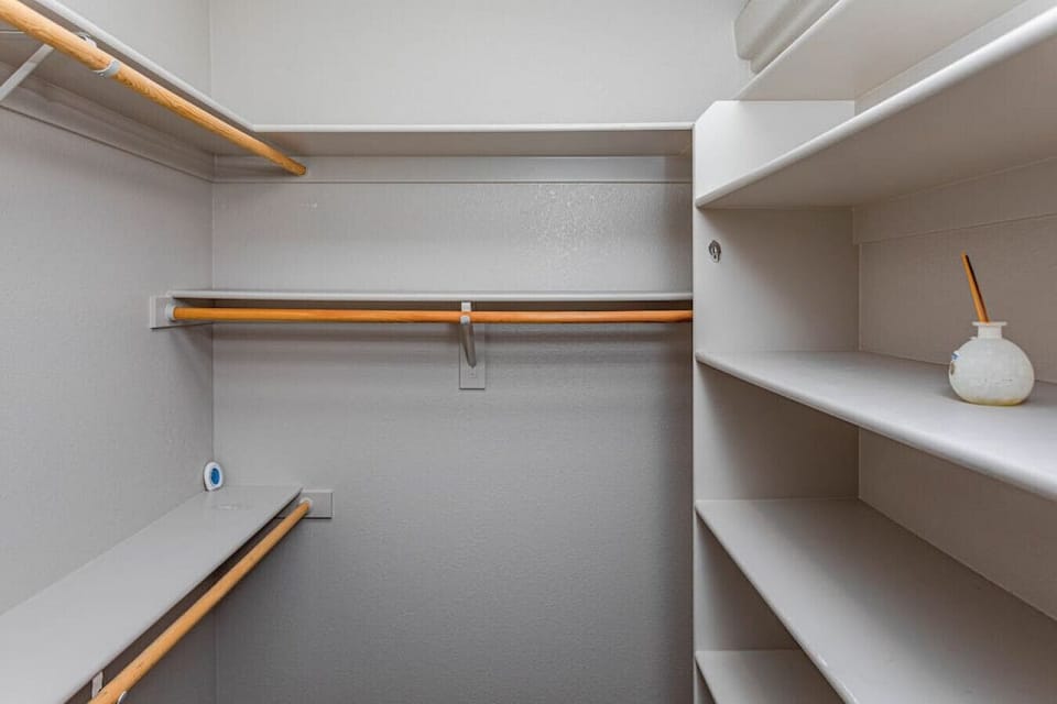 Primary closet with plenty of space to hang your clothes.