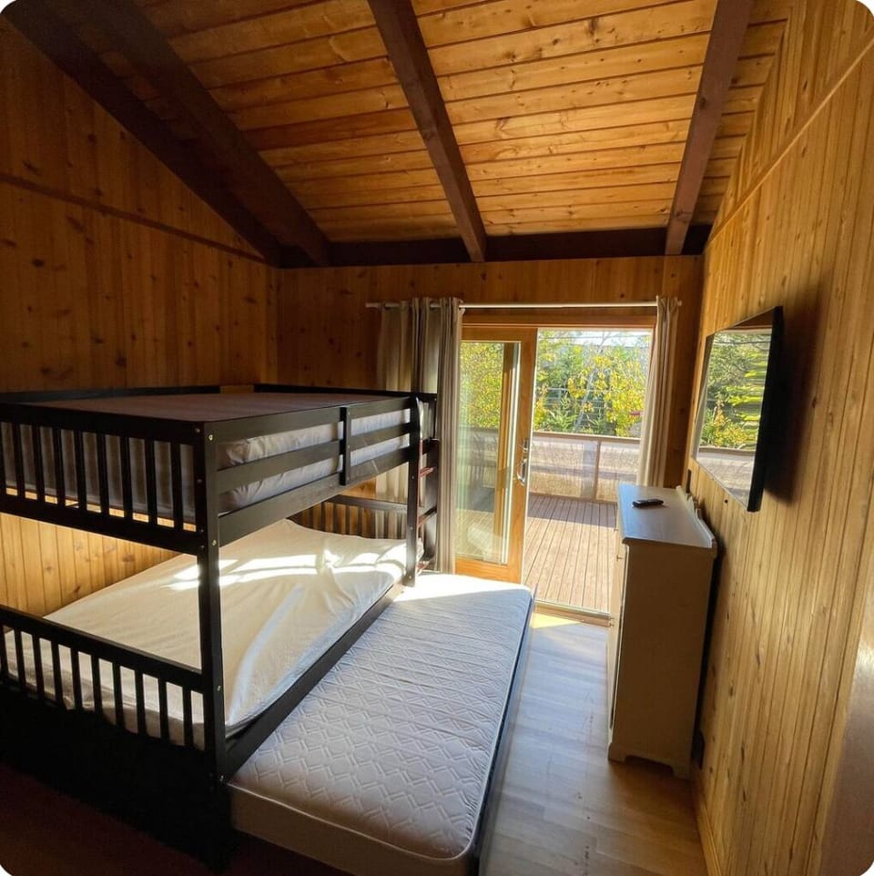 Bedroom with full-size bunkbeds and twin trundle