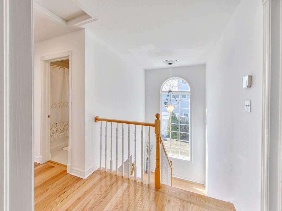 Beautiful arched window by the staircase