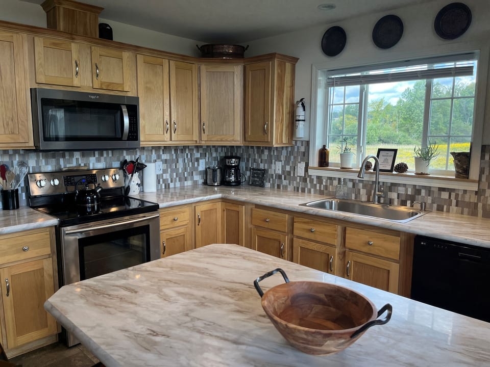 New kitchen with stainless steel applicances
