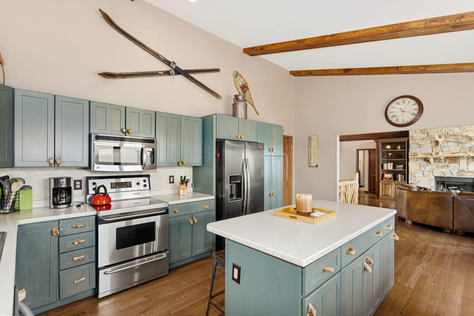 Kitchen with Stainless Appliances  and Central Island with Bar Stool Seating
