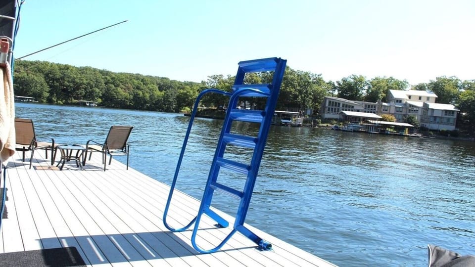 Large swim platform with diving ladder and ladder to assist getting out of the water..
