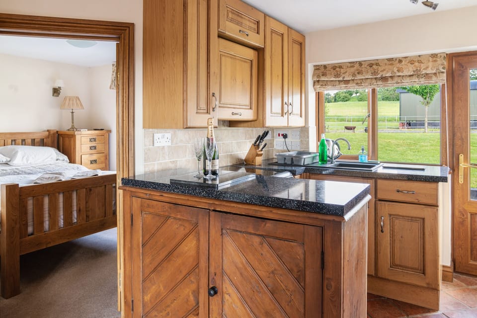 Coach House kitchen leading to the outdoor garden & optional Salt water hot tub 