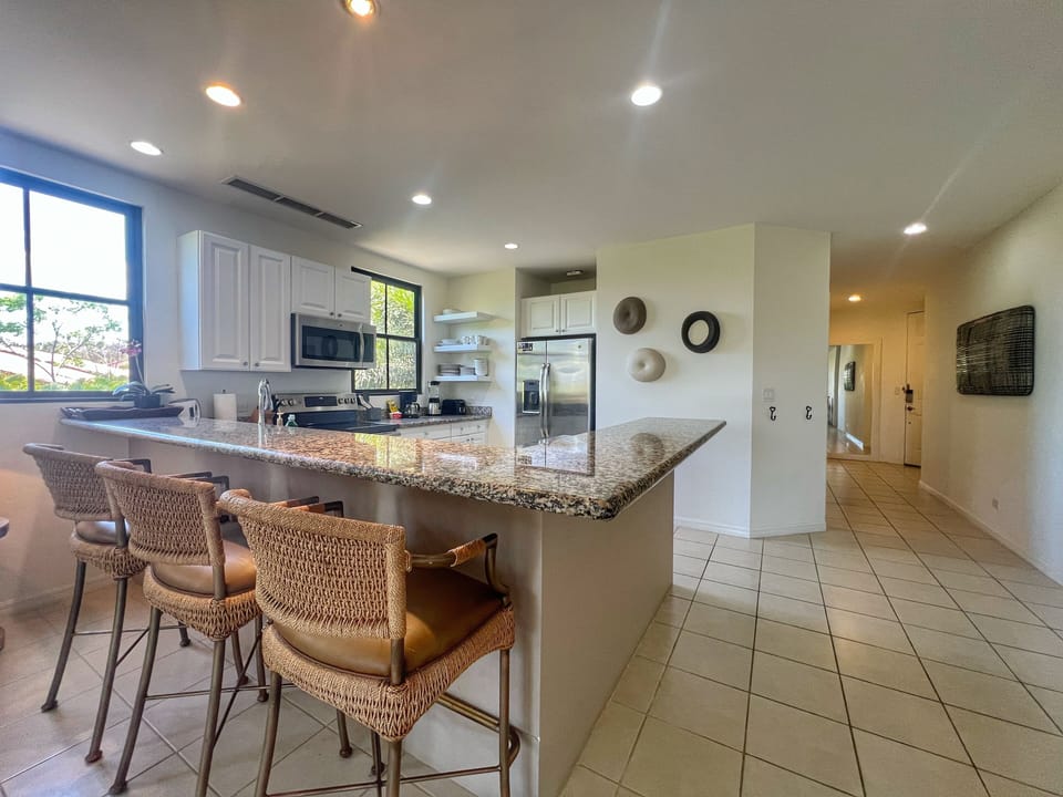 The large, fully-equipped kitchen includes all the amenities needed to make this unit your home away from home.  
