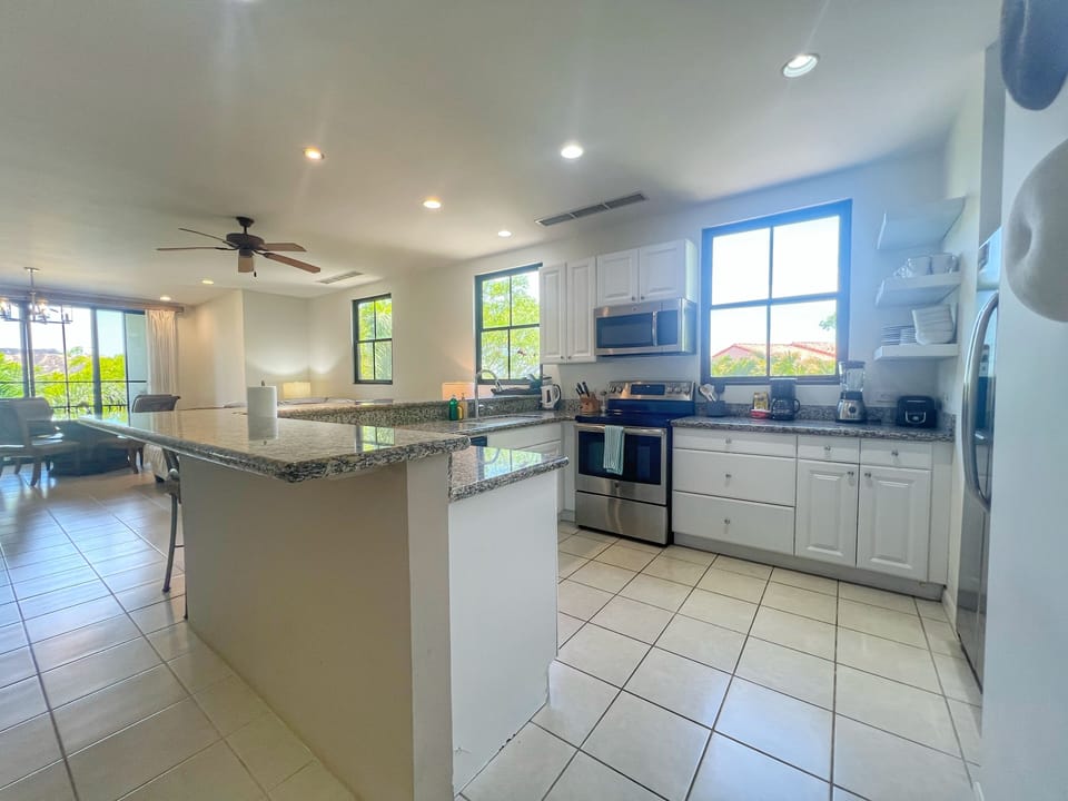 The large, fully-equipped kitchen includes all the amenities needed to make this unit your home away from home.  
