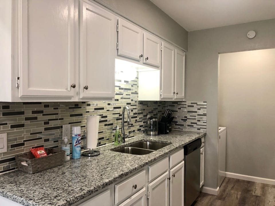 Granite kitchen countertop with full stocks and appliances 