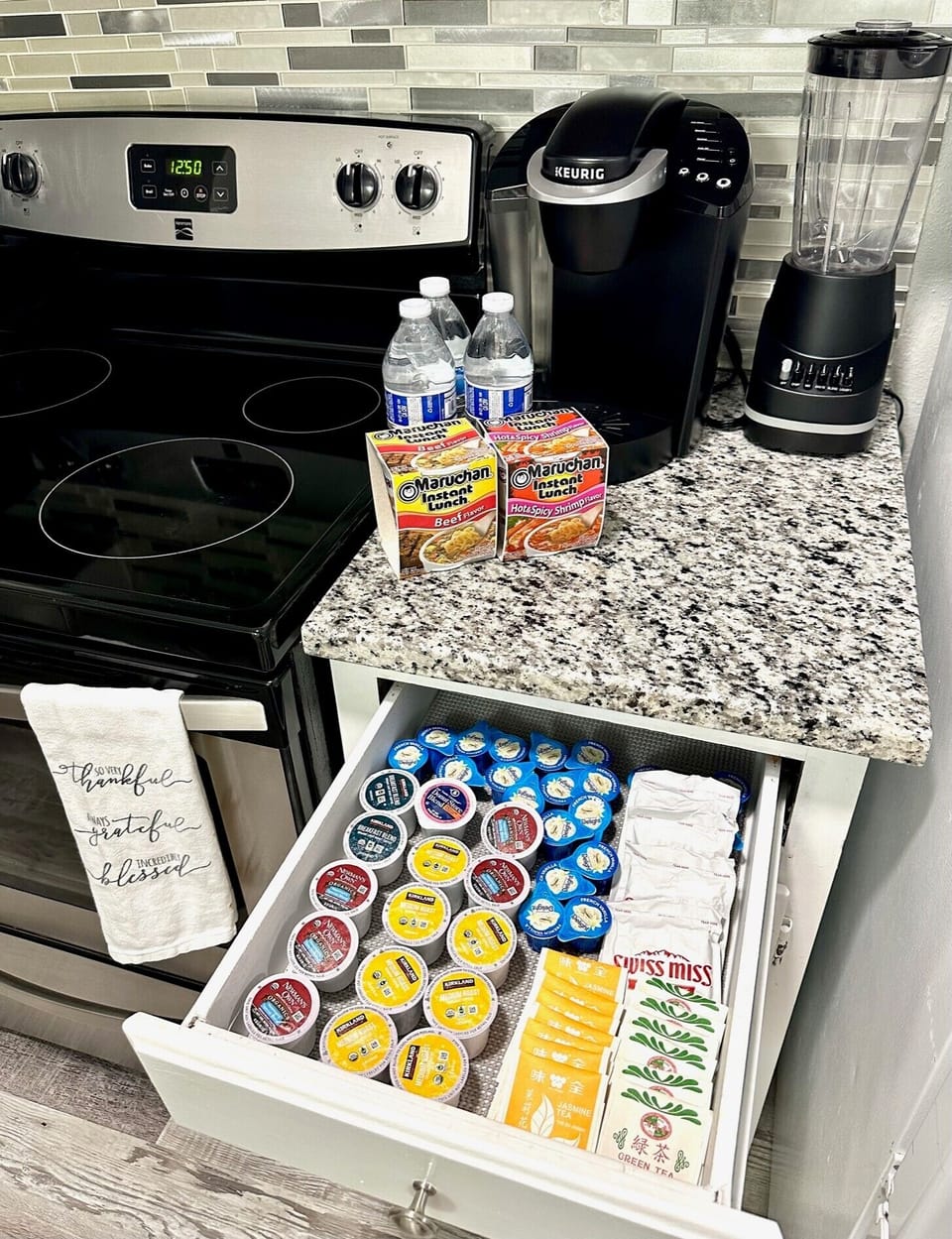 Coffee machine with coffee pods, teas, creamers, instant noodles, water bottles