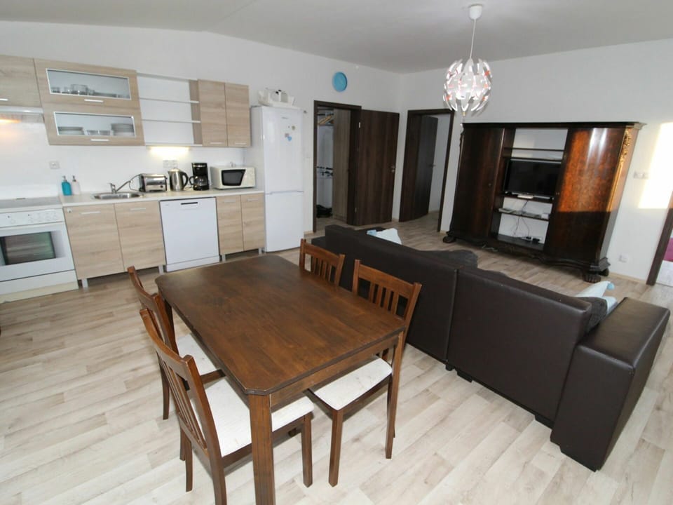 Furniture, Table, Cabinetry, Countertop, Couch, Wood, Lighting, Flooring, Living Room, Interior Design