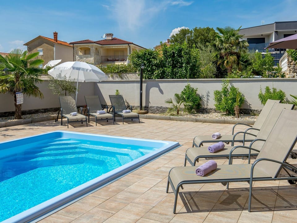 Water, Plant, Sky, Cloud, Furniture, Property, Building, Chair, Swimming Pool, Azure