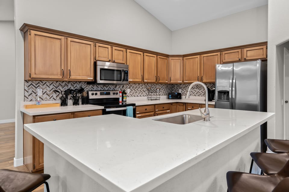 Fully stocked kitchen ready for you!

Huge island with a ton of prep space!