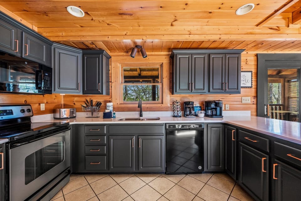 kitchen with granite counters and cookware