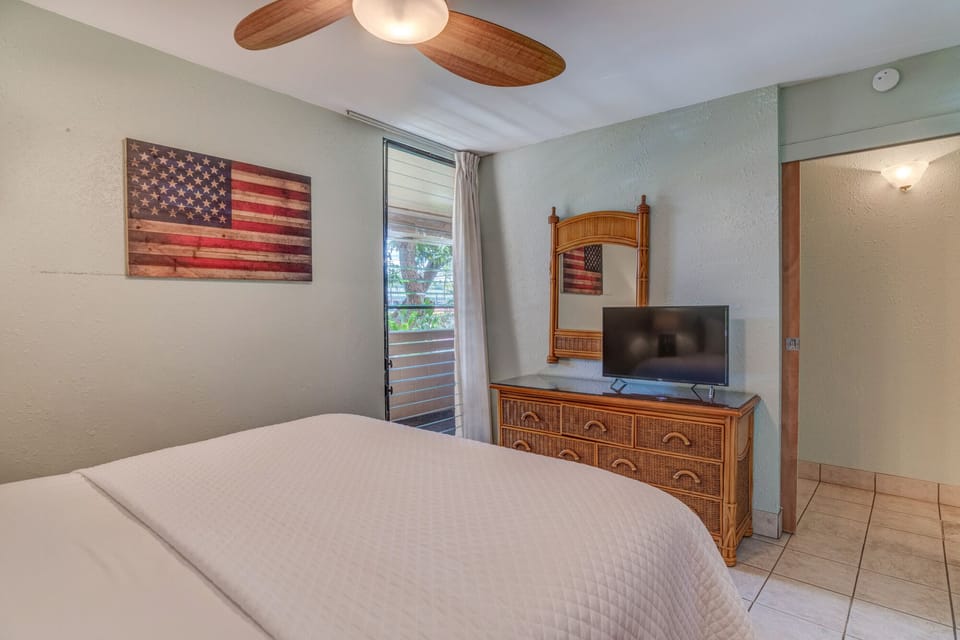 Flat-screen TV in the bedroom with a dresser for extra storage