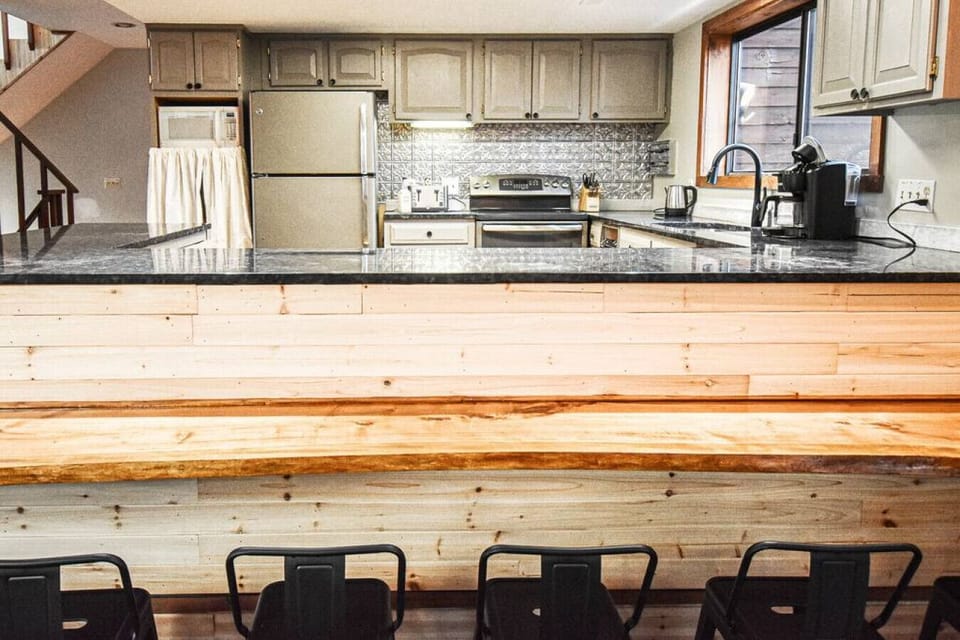 Live edge maple slab bar for extra seating for meals or drinks
