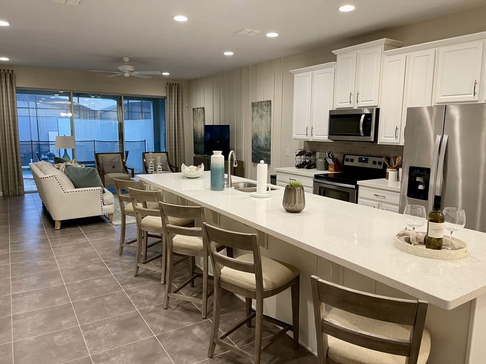 Spacious & open kitchen with plenty of seating. A welcoming space for gatherings