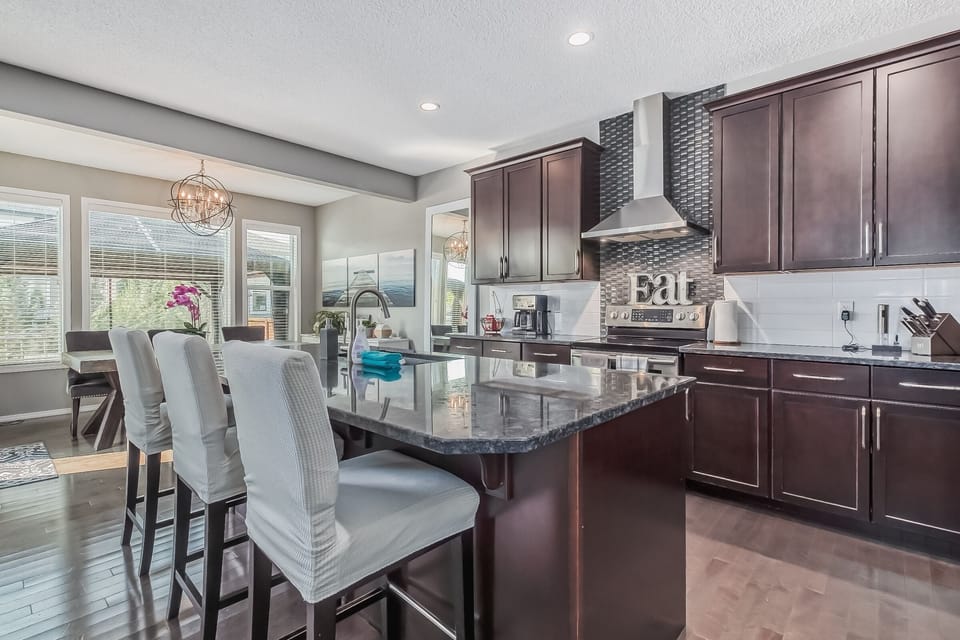 Gourmet kitchen, well-stocked with cookware, utensils, seasonings and spices.
