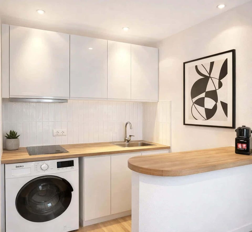 A well-equipped kitchen with washer awaits you for your stay.
