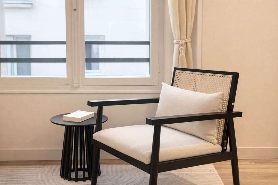 Find peace in this comfortable chair while enjoying a tranquil reading moment.
