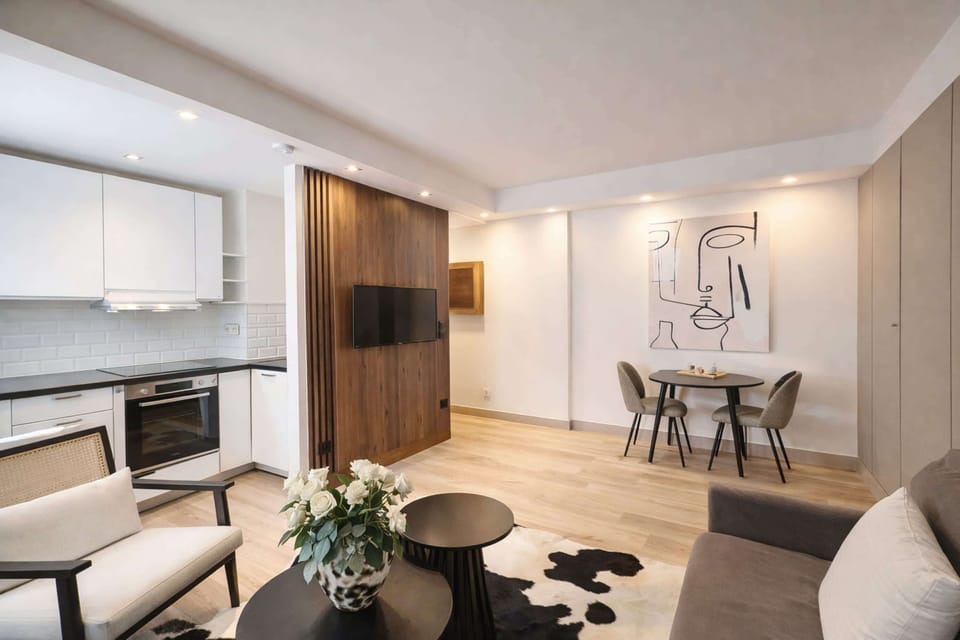The living area includes a sofa, HD TV, and high-speed Wi-Fi for your use.
