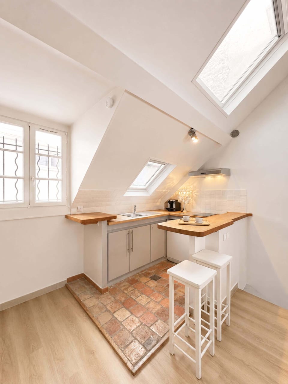 A modern kitchen with a beautiful view of Paris, making every meal special
