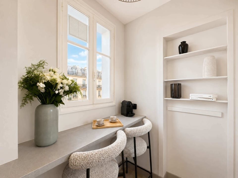 A stylish table for meals or work, seating for two persons.