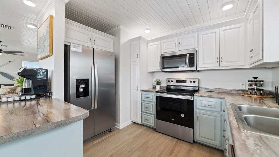 In our modern kitchen, sleek stainless steel appliances blend style and functionality