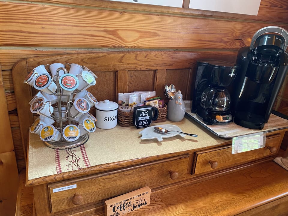 Coffee bar with 4 cup coffee maker, keurig, coffee pods and tea bags.