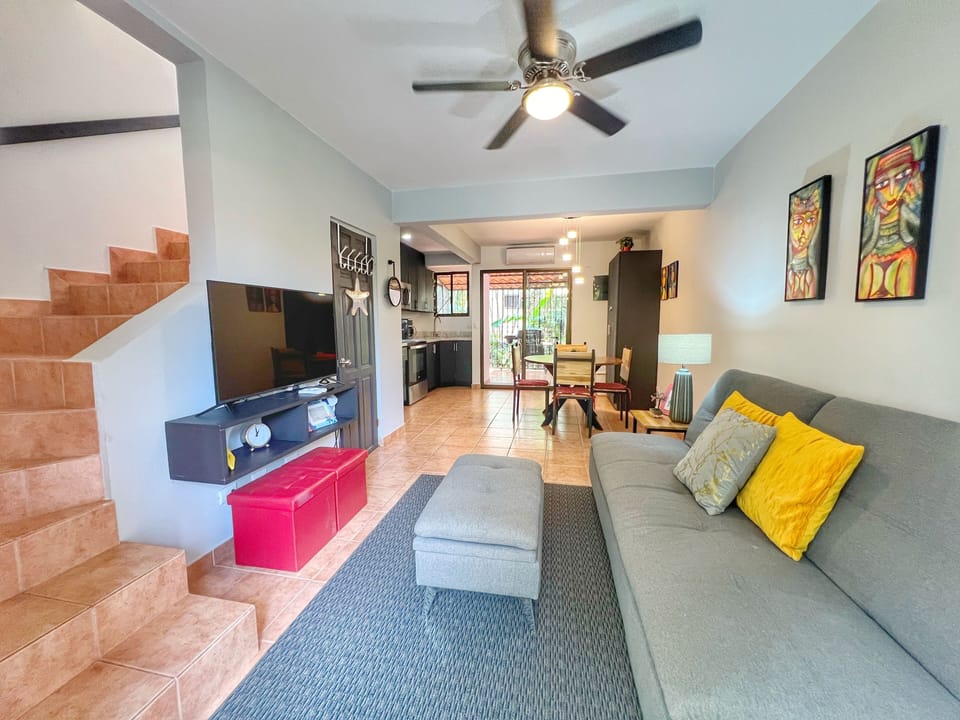 The unit has an open concept main floor has a comfortable living space, dining area, half bath, full kitchen and screened back terrace with laundry and gas BBQ.