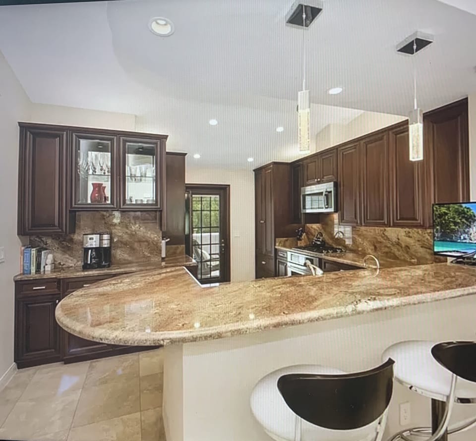 Beautifully remodeled kitchen with granite counters and upgraded cabinets 
