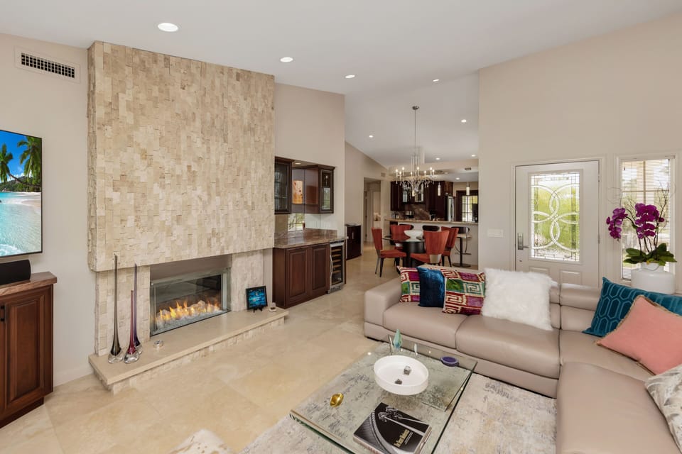 The open floor plan and vaulted ceilings provide a bright living space for guest