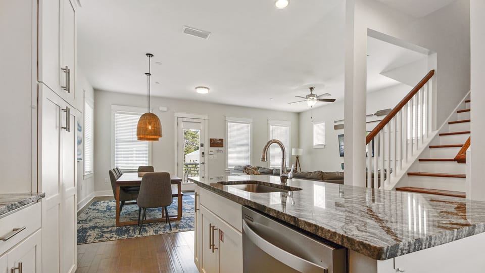 Open concept kitchen, dining & living room