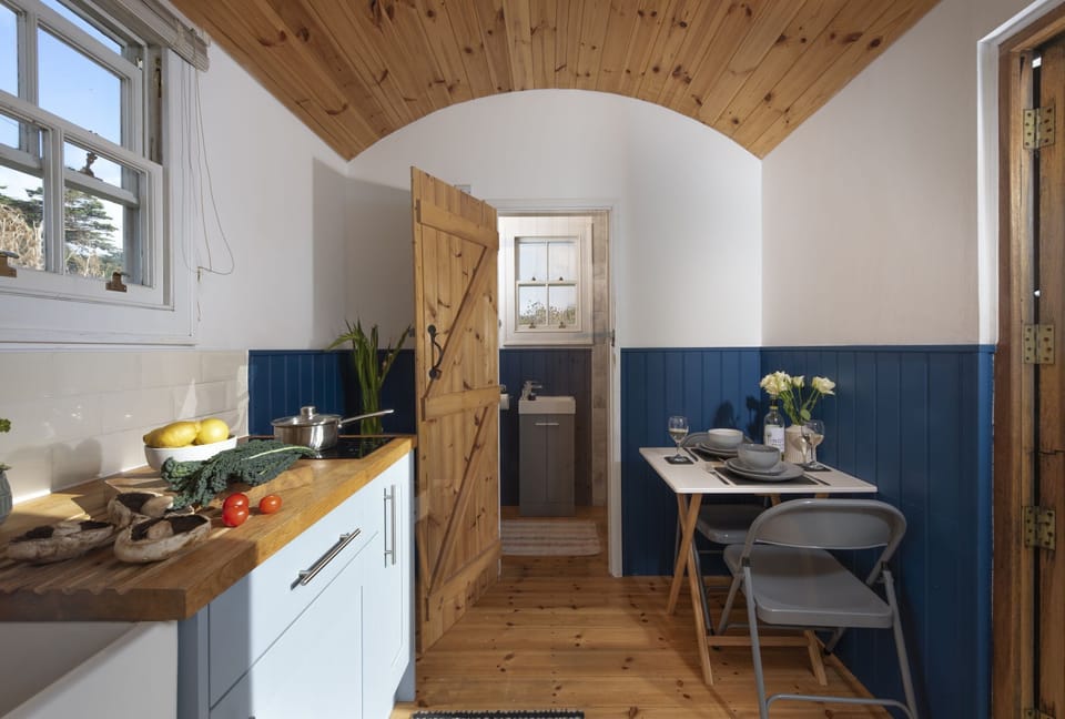 Dining area leading to bathroom area Nori's Nest, Shepherds Hut, Croft Hooper