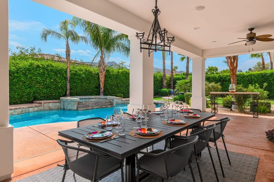 Expansive Covered Patio Features Outdoor Dining For Eight
