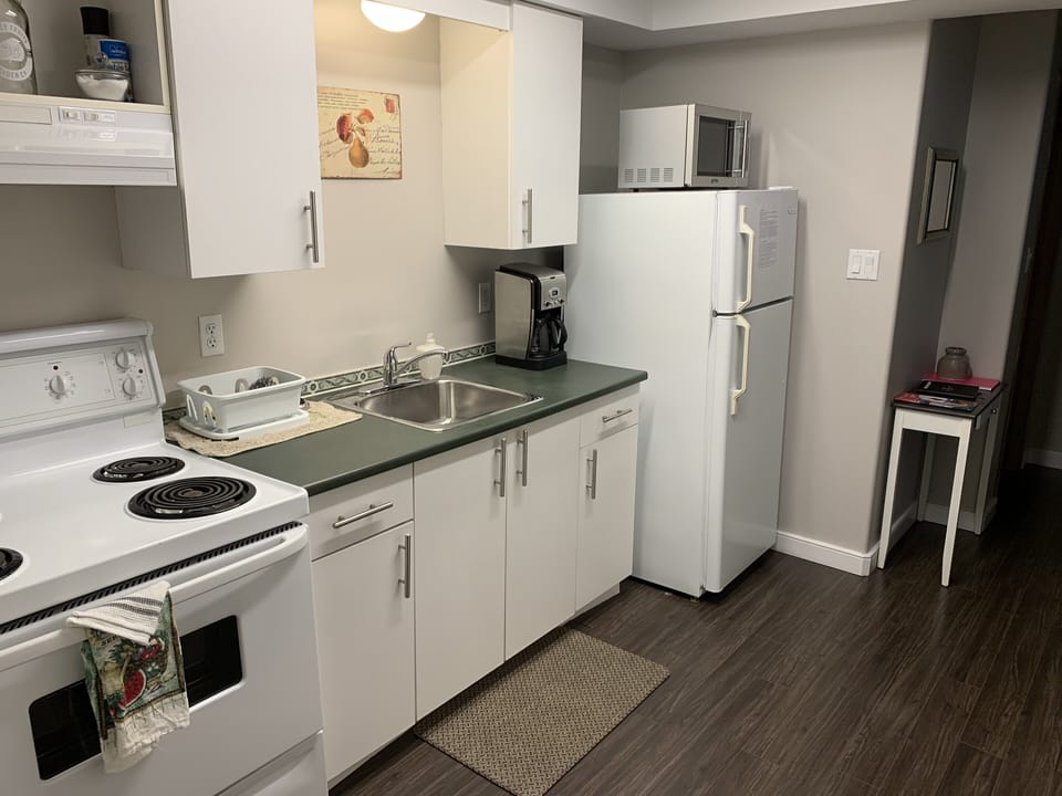 Kitchen with full range/fridge and freezer