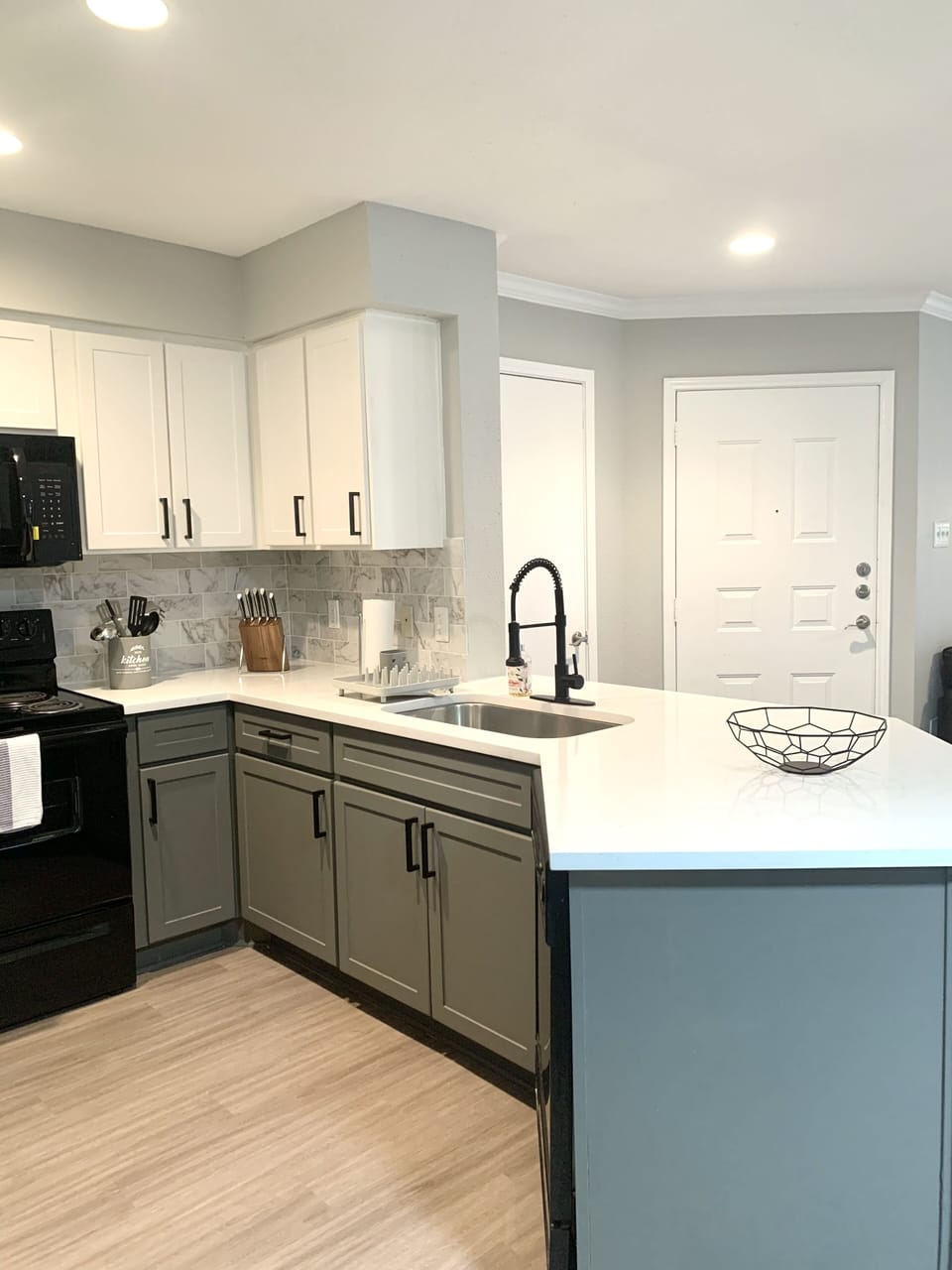 Modern kitchen with clean lines and granite countertops.