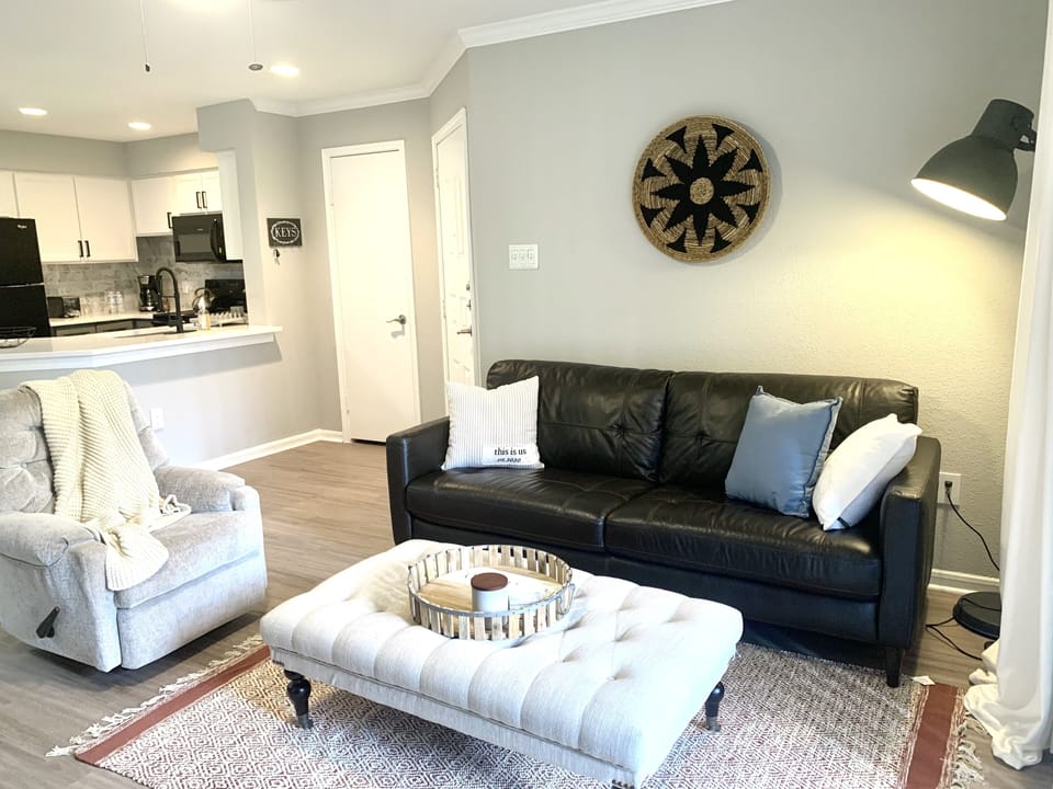 Living Room has luxurious leather sofa and comfortable recliner chair.
