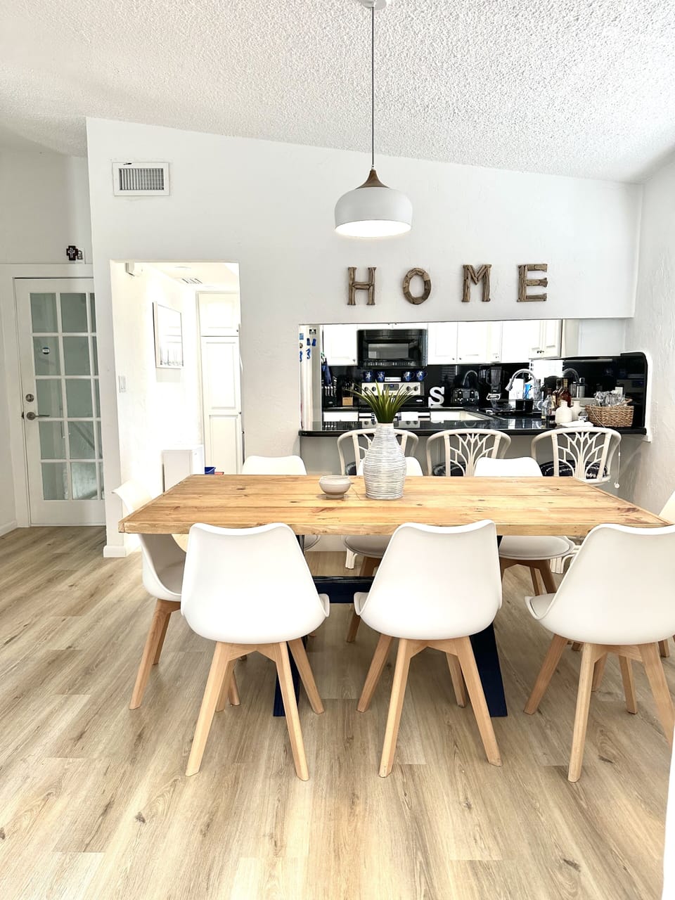 View of dining room and kitchen. 