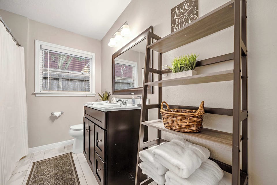 Restroom: Bright and stylish oasis with modern fixtures and plush towels for your comfort!