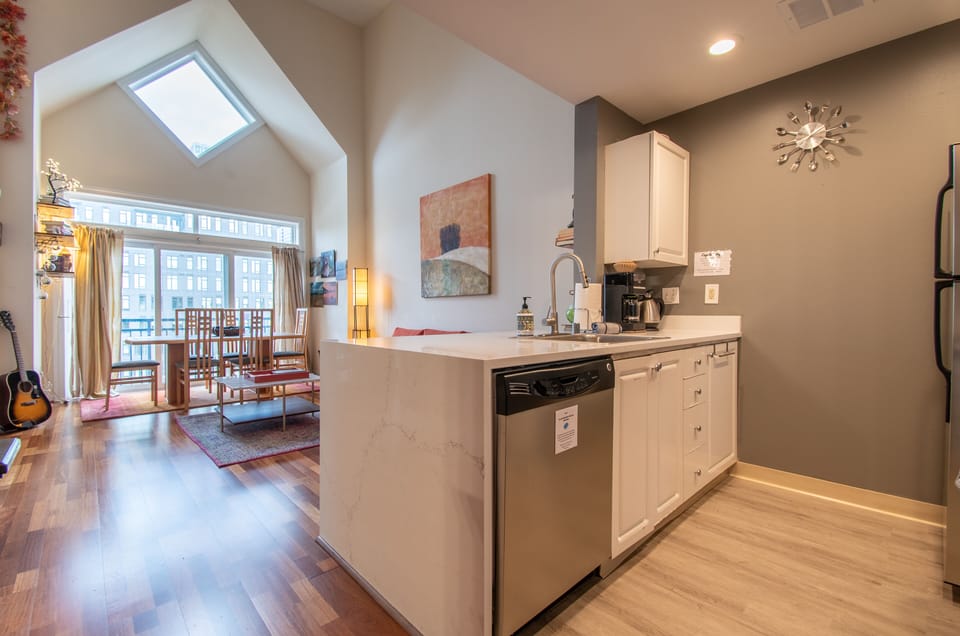 Fully equipped kitchen with stainless steel appliances.
