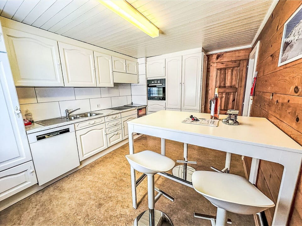 Kitchen, Flooring, Furniture, Floor, Interior Design, Countertop, Wood, Cabinetry, Kitchen Appliance, Major Appliance