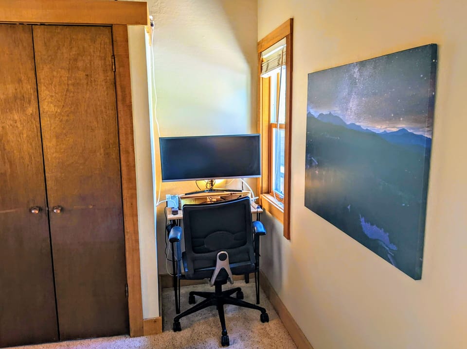 Desk, wide monitor, office chair. To get work done, if needed. Hope not. 