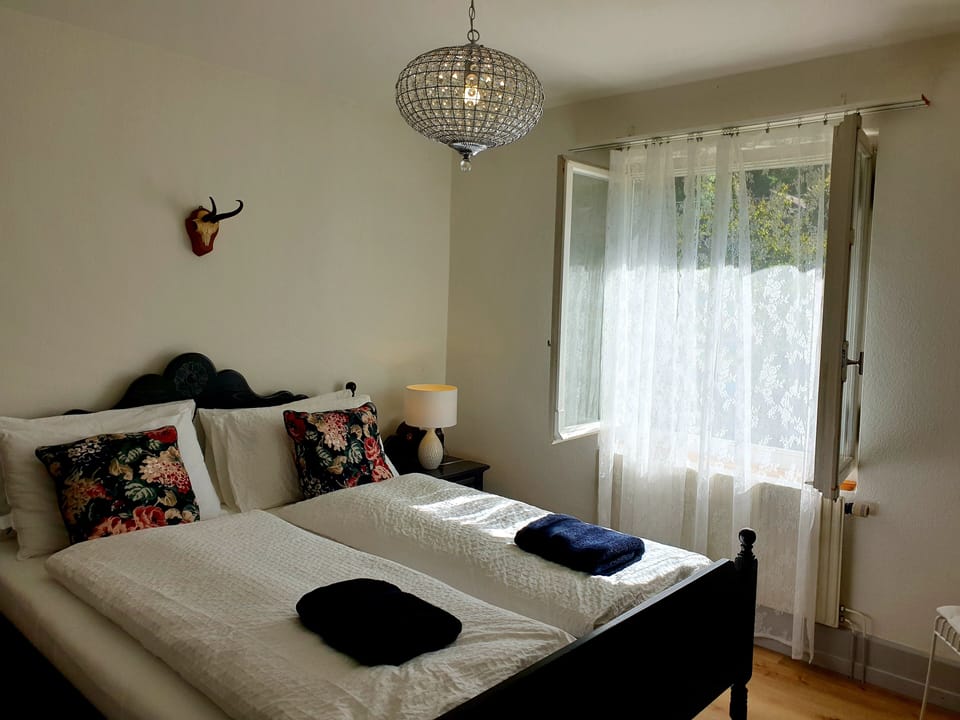 Bed 1. Wardrobe. Bedside lighting.   Beautiful views of back garden and mountain