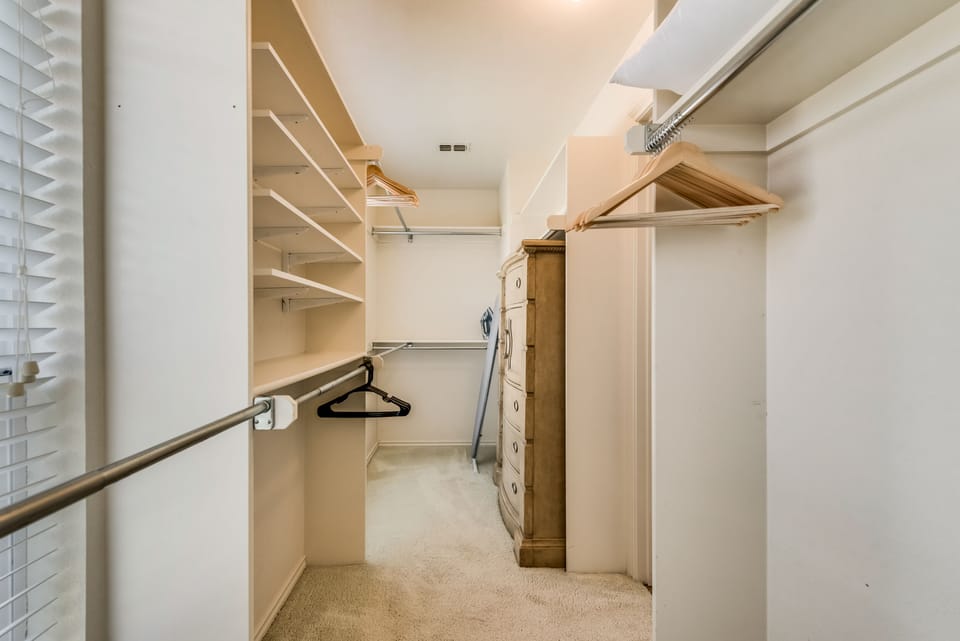 Upstairs bedroom with king bed, bathroom and private balcony.