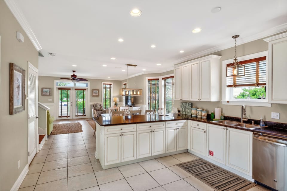 Bright, open-concept kitchen and living area with expansive seating, perfect for gathering and entertaining.